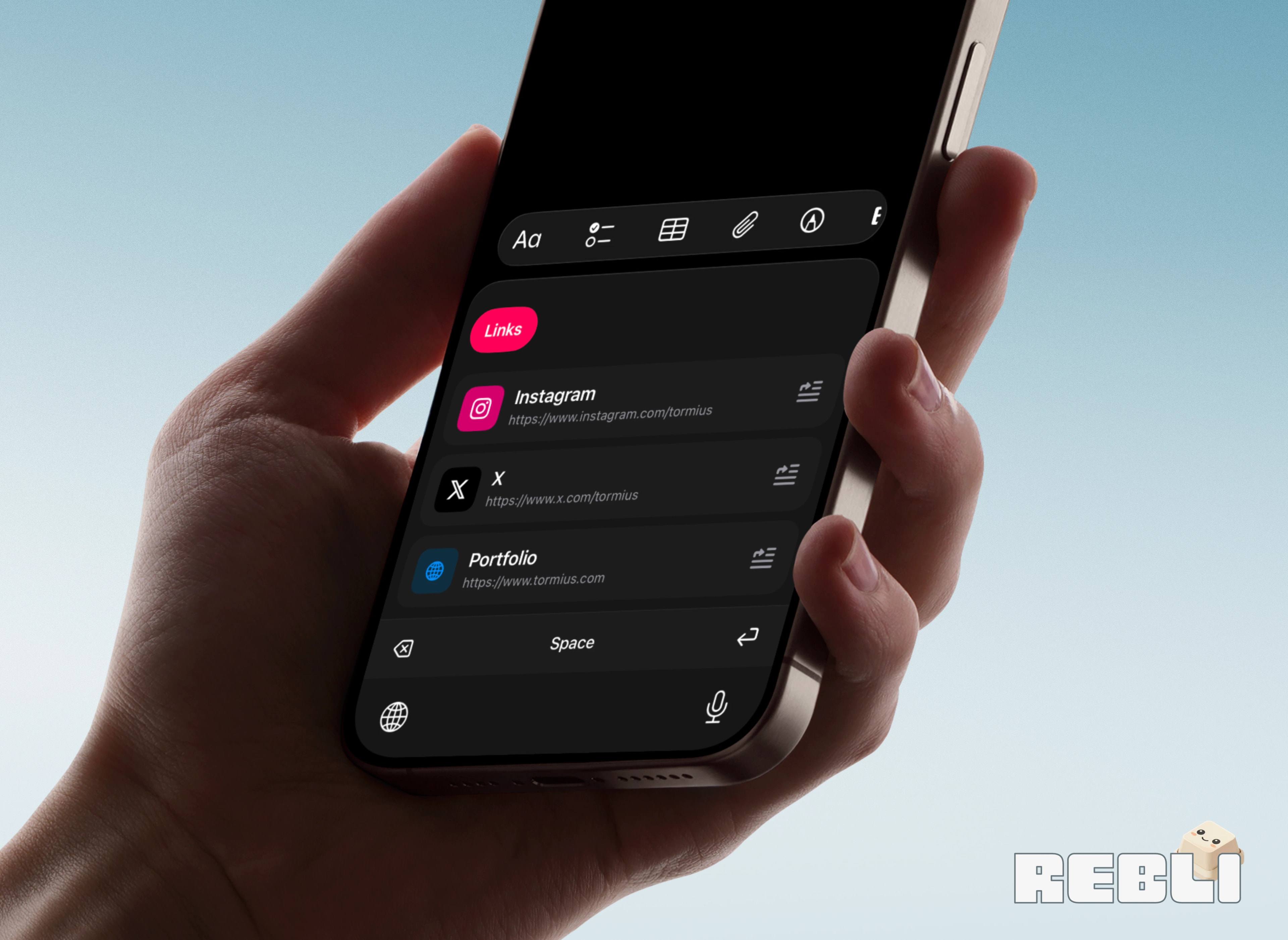 Rebli custom keyboard shown in dark mode on a phone held in one hand